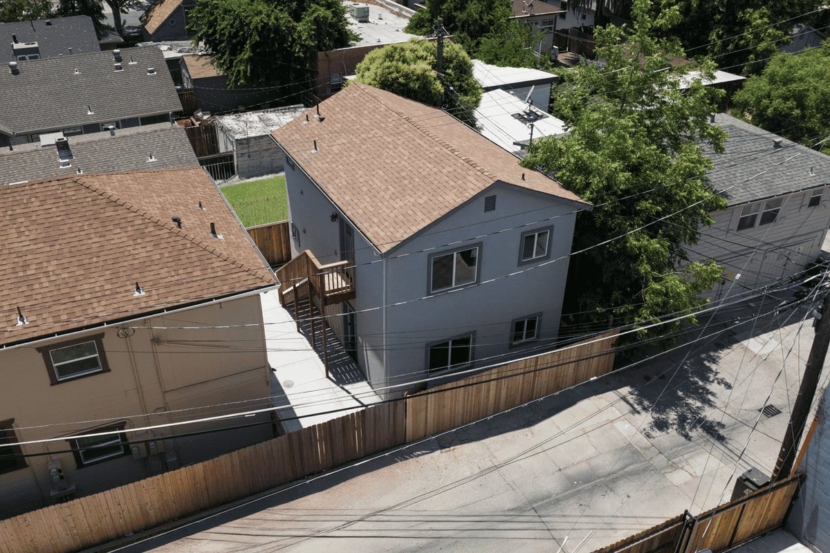Aerial view of a completed two-storey alley-loaded ADU behind an older Sacramento home